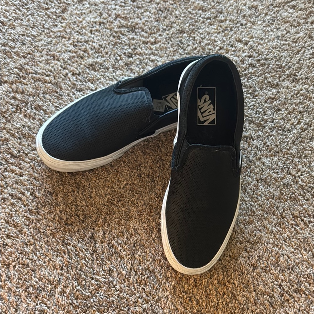 Vans women’s black leather slip ons. Size 10